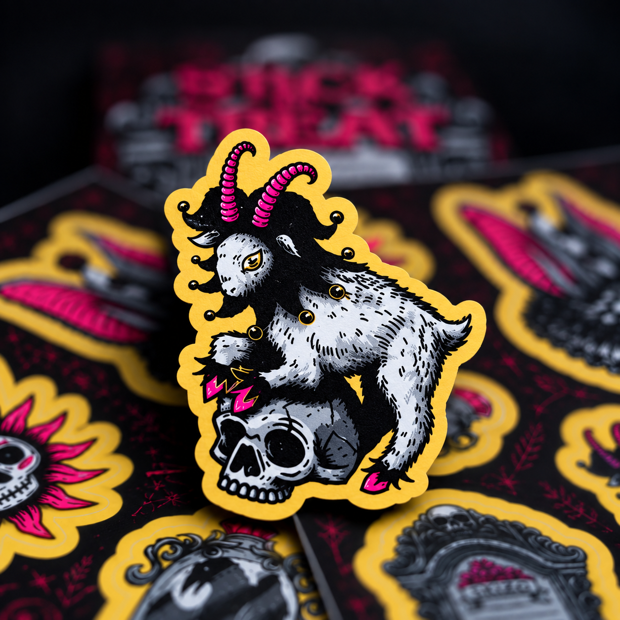 A goat with a pink joker hat, standing on a skull, with stickers in the background