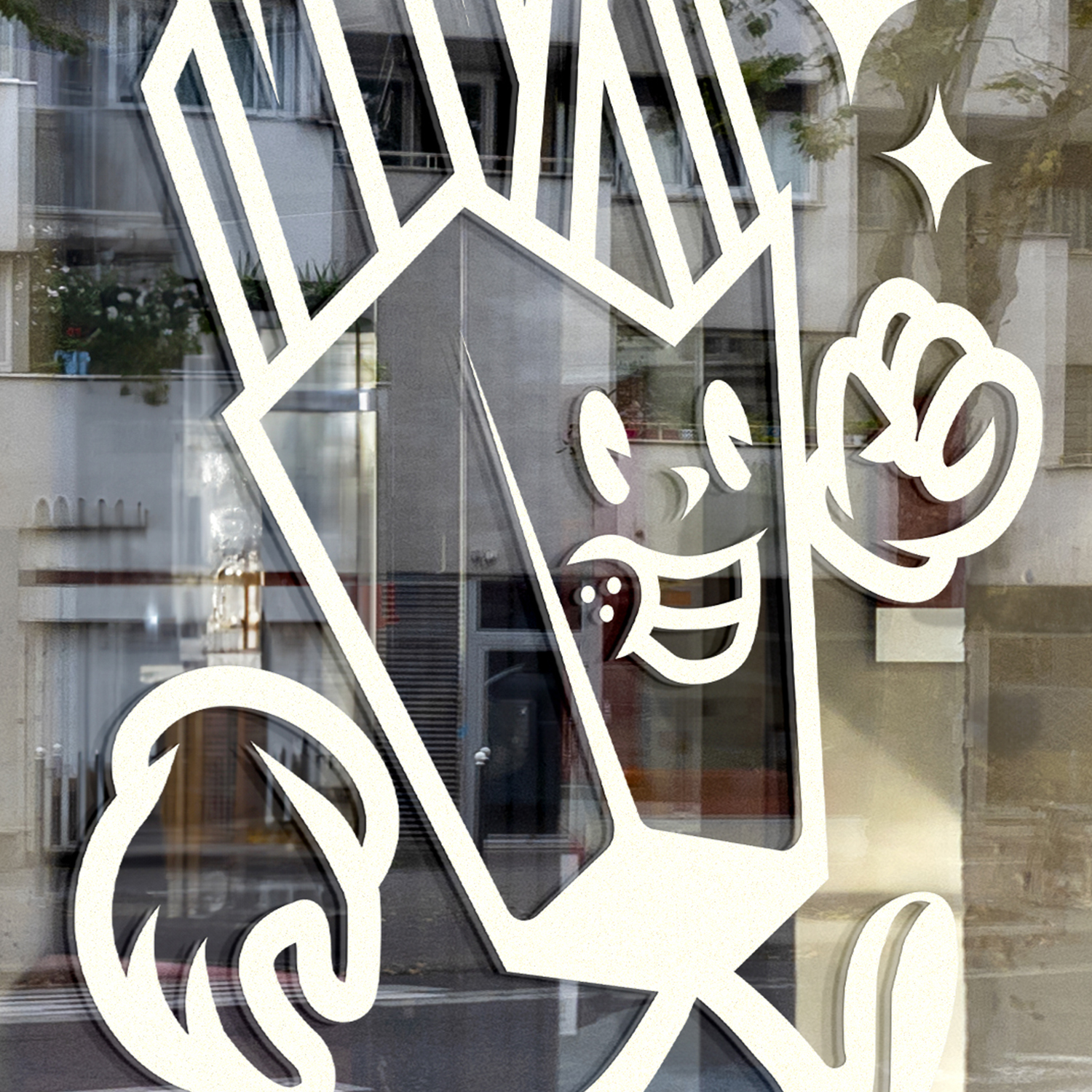 Close up on a Cartoon French fry character, on transfer vinyl, on a window, smiling and running with one arm raised. Building and tree reflections in the glass.