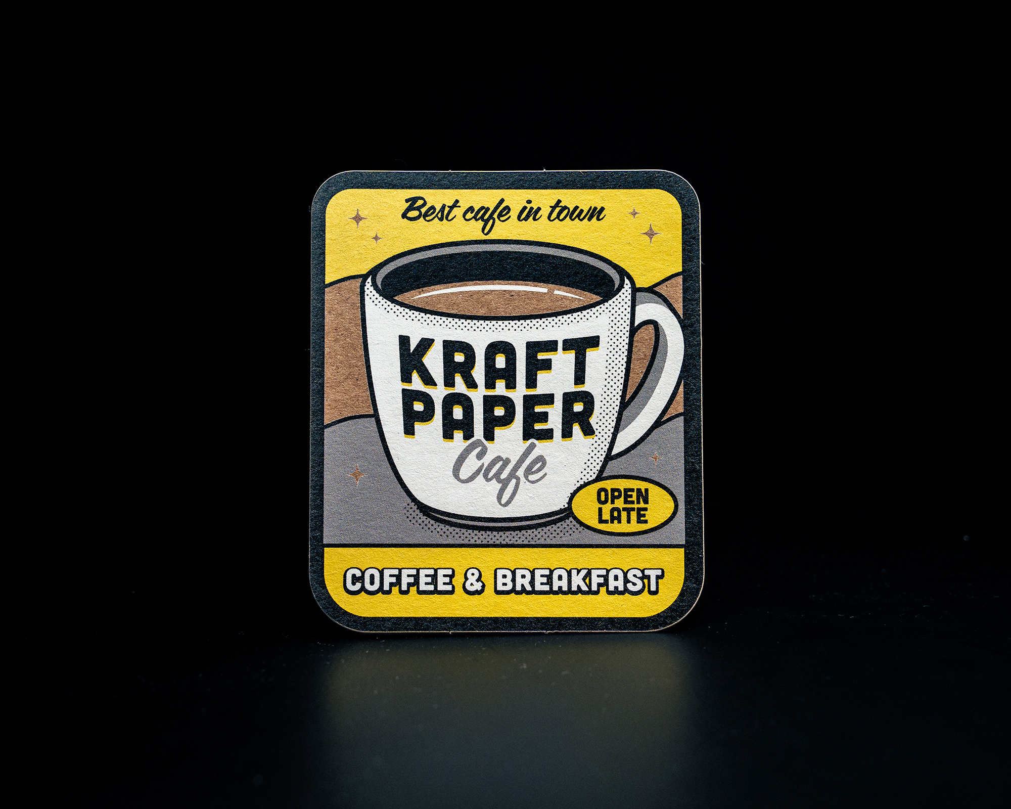 Square sticker with "Kraft Paper Cafe" logo, featuring a coffee cup design, "Best cafe in town," and "Coffee & Breakfast."
