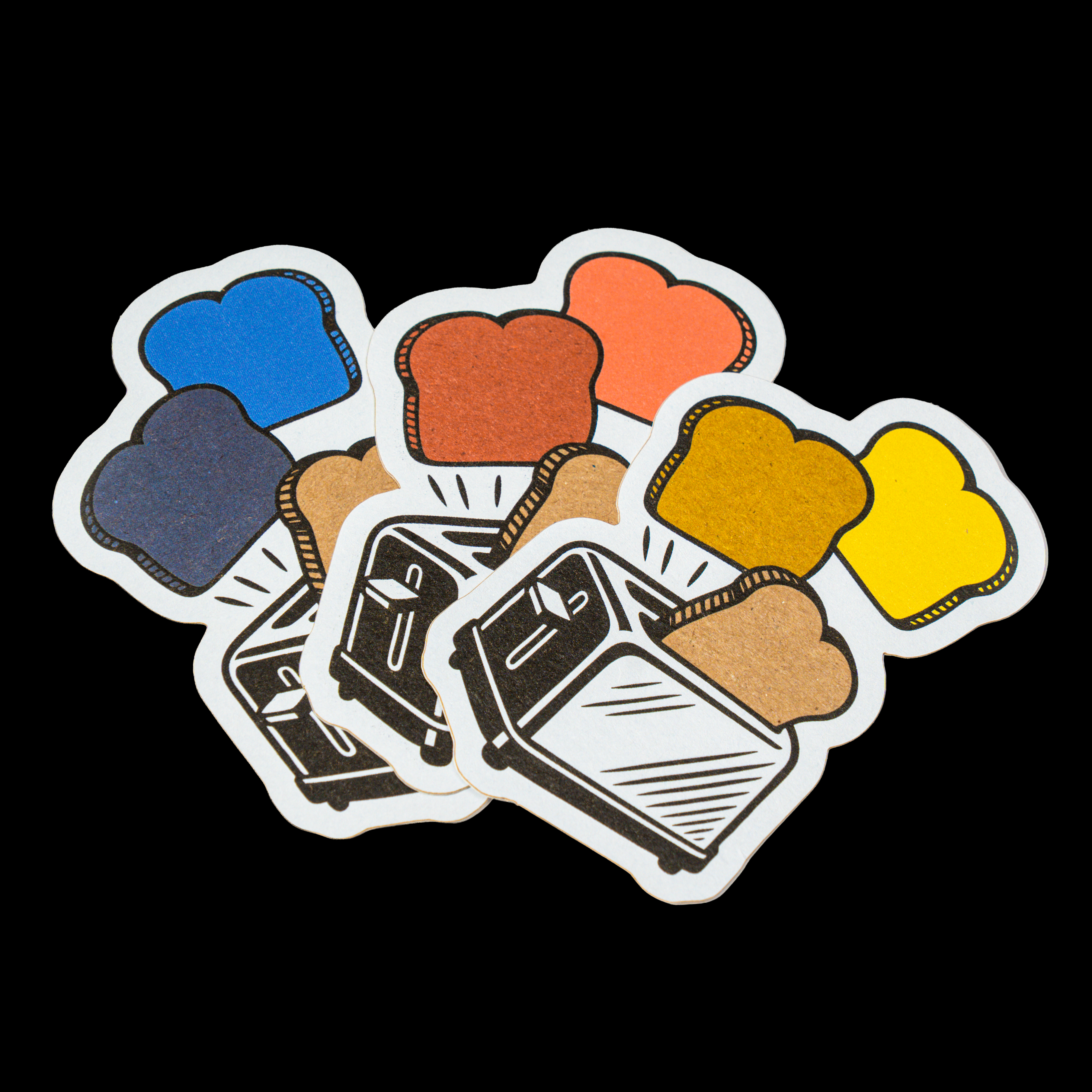 Colorful die cut sticker featuring a toaster with popping slices of bread in different colors, arranged as a small sticker stack