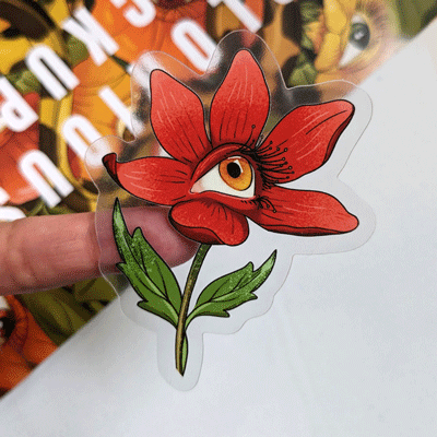 Red flowered sticker with eye and clear border