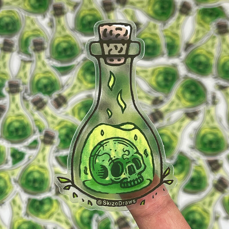 Transparent die-cut sticker of a skull floating in a bottle with green elixir, against a background of stickers.